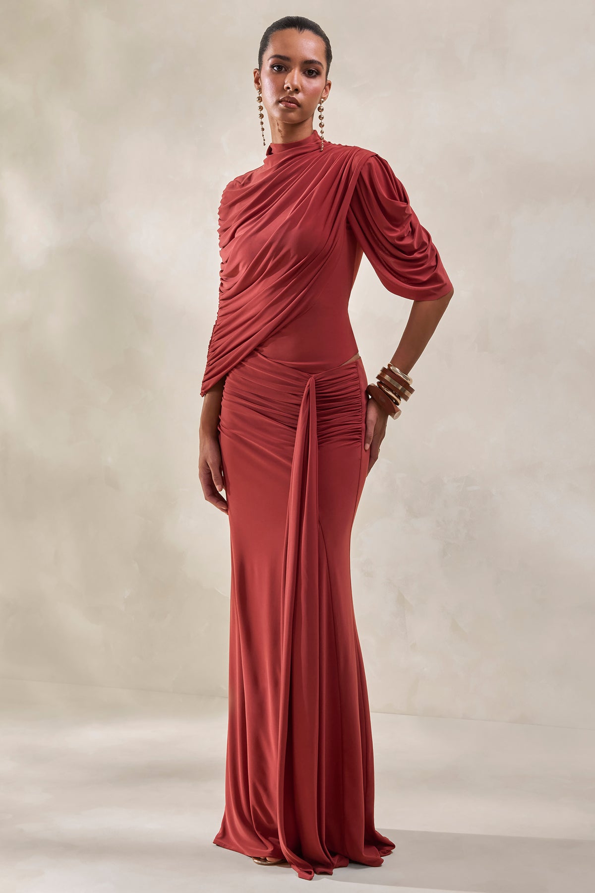 ECM_HR_CL137954071---Fenicia-_-Rust-High-Neck-Bodysuit-With-Cape-Detail-+-CL137956071---Mireya-_-Rust-Wrapped-Maxi-Skirt-With-Split0.jpg