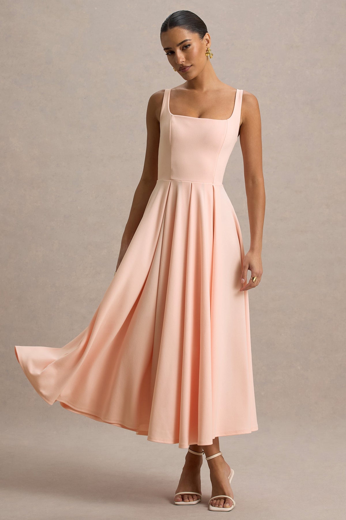 Parina | Różowa sukienka midi na ramiączkach z rozkloszowanym dołem