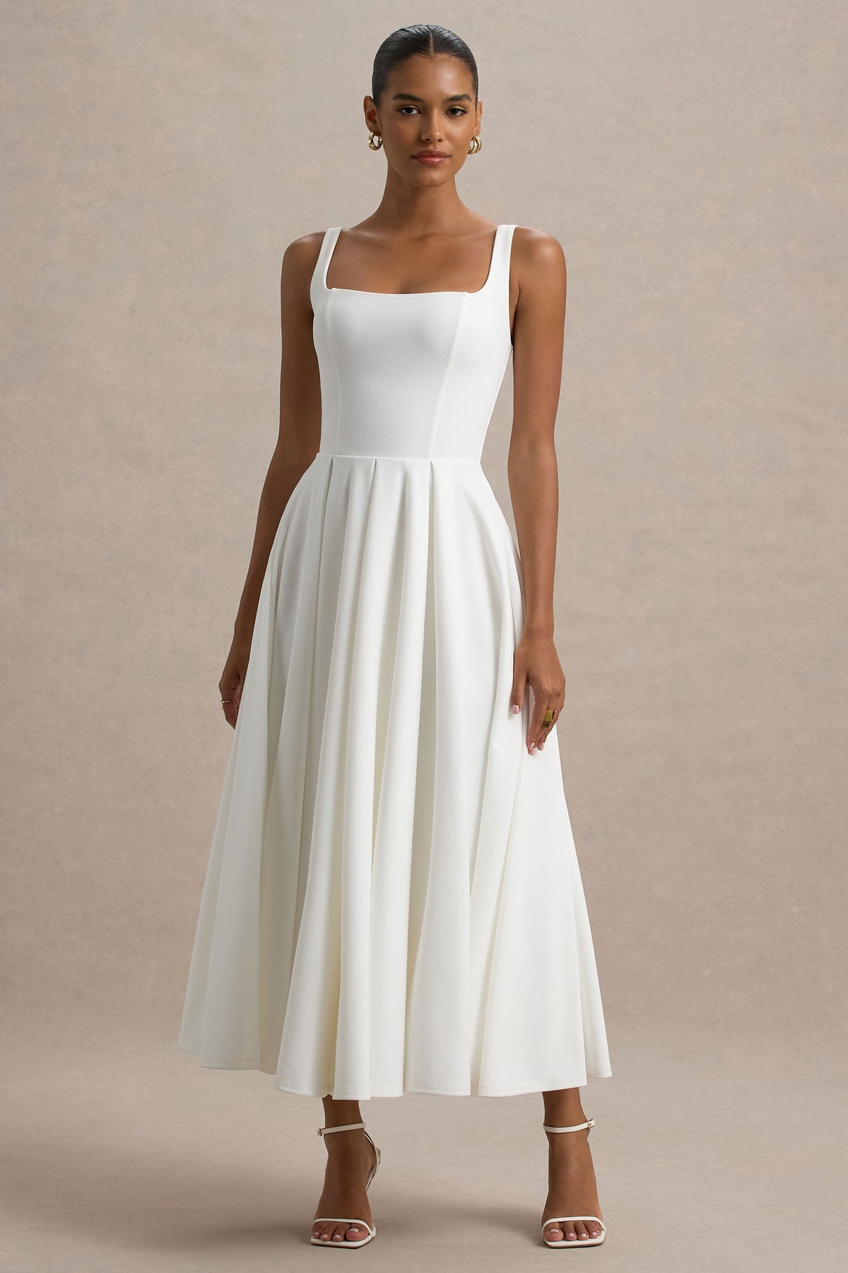 Parina | Biała sukienka midi na ramiączkach z rozkloszowanym dołem